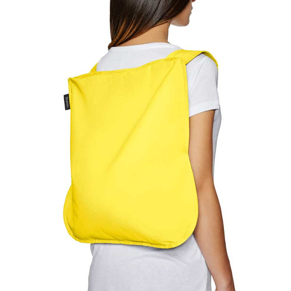 Notabag Yellow 2 in one tote bag and backpack shown as backpack on lady