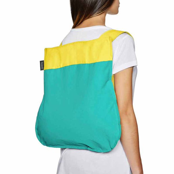 Notabag Yellow & Mint 2 in 1 back and backpack shown used as backpack